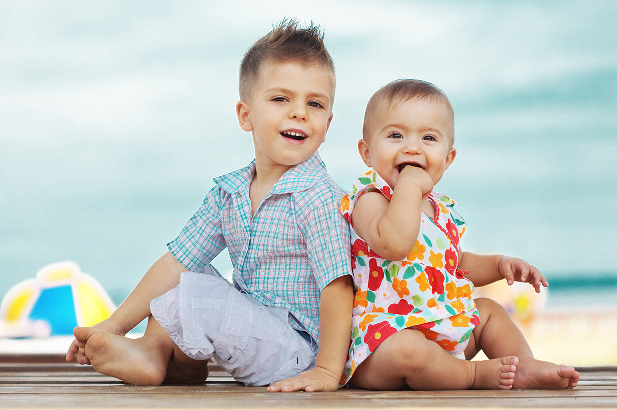 Two cute baby are playing